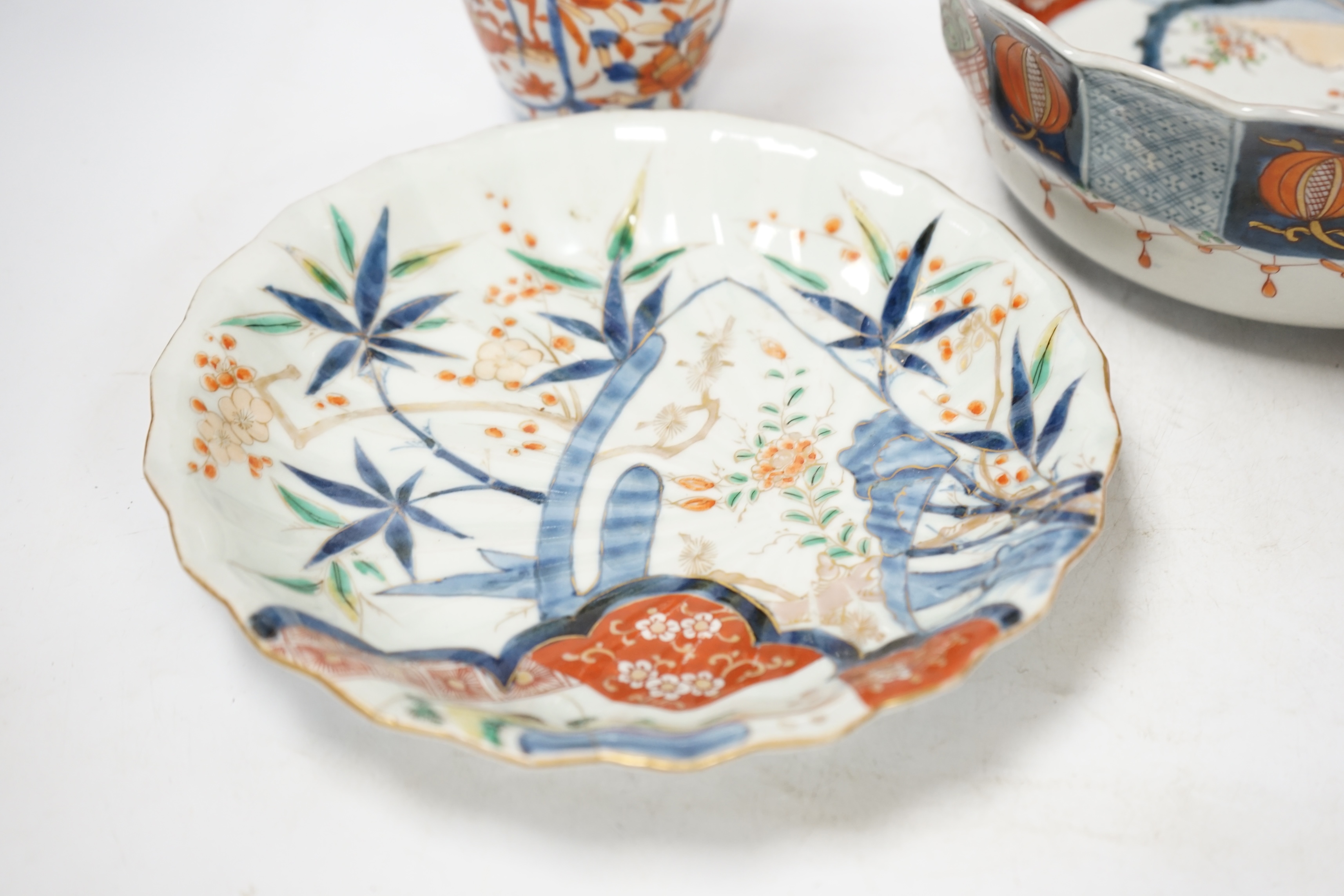Japanese ceramics to include an Imari vase and bowl and a blue and white dish, 22cm diameter. Condition - two bowls and dish good, others poor